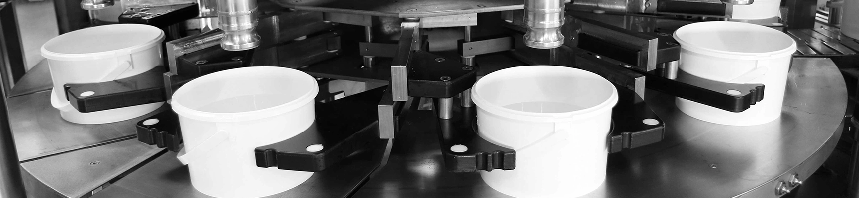 Man standing next to a machine for bottles